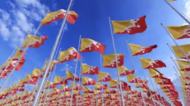 Mavi arka planda dalgalanan Butan bayrakları. Refah konsepti. Bhutan 'ın ulusal bayrakları temiz mavi gökyüzüne özgürce el sallıyor. Butan' ın bayraklarının 3D gerçekçiliği. 