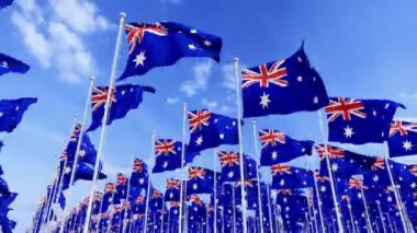 Yüksek çözünürlüklü Avustralya bayrakları mavi gökyüzü ile rüzgarda dalgalanıyor. Avustralya ulusal bayrakları yazın mavi gökyüzünde dalgalanıyor. Rüzgar, vatansever, sembol, kanat çırpan, ulusal, gökyüzü.