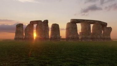 Sunset at the Stonehenge, United Kingdom. Digital render.Prehistoric megalithic monument Stonehenge. Beautiful panorama of Stonehenge early morning. Sunrise glow seen on the historical landmark.