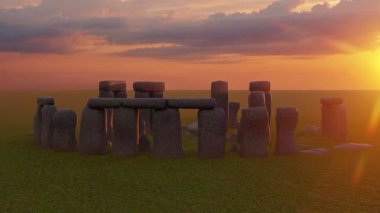 Sunset at the Stonehenge, United Kingdom. Breathtaking sunset view of Stonehenge with sunlight streaming through the ancient stones.