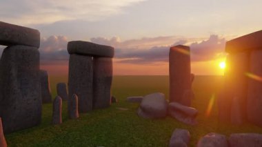 Sunset at the Stonehenge, United Kingdom. Breathtaking sunset view of Stonehenge with sunlight streaming through the ancient stones.