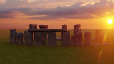 Sunset at the Stonehenge, United Kingdom. Breathtaking sunset view of Stonehenge with sunlight streaming through the ancient stones.
