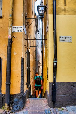 STOCKHOLM, SWEDEN - JULY 31, 2022: Marten Trotzigs Grand is the narrowest street in Stockholm. clipart