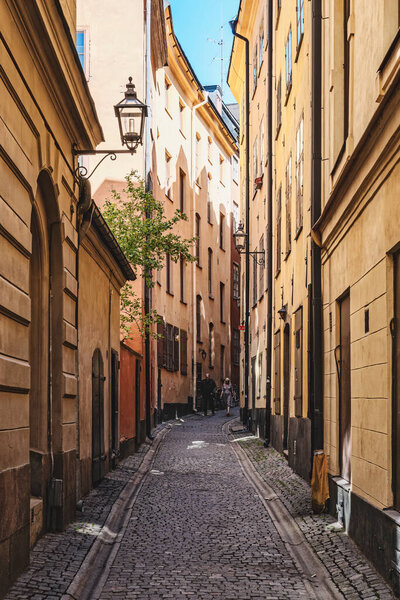 STOCKHOLM, SWEDEN - JULY 31, 2022: One of the many old cobbled narrow streets in the Gamla Stan area.
