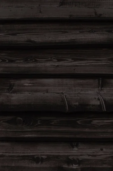 板で作られた濃い灰色の古い木製の壁の終わり — ストック写真
