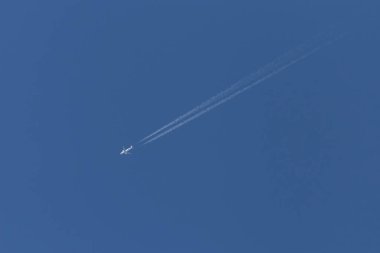 view on aircraft flying in a clear blue sky