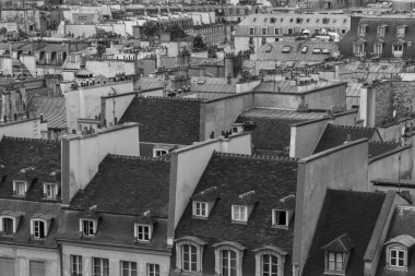 black and white photo of roofs of buildings in Paris