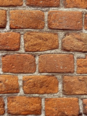 construction background: close up of wall made of red bricks
