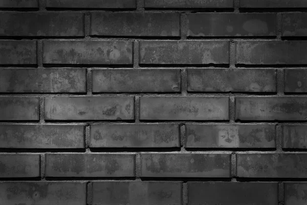 Czarno Białe Zdjęcie Ciemnej Cegły Ściany Podświetlanym Środkiem — Zdjęcie stockowe