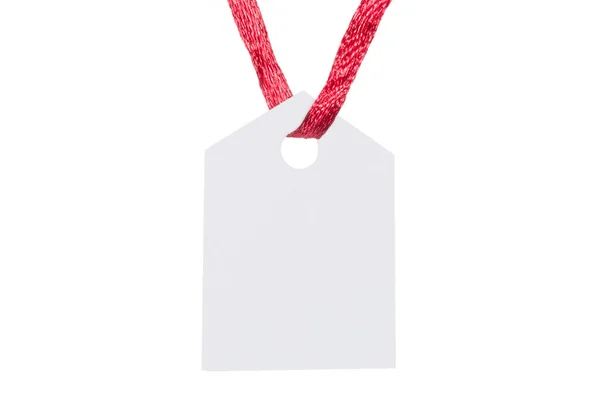 white paper tag hanging on red ribbon against white background