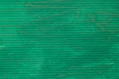 soyut arkaplan: yeşil gouache ile boyanmış çizgili kağıdın kapatılması