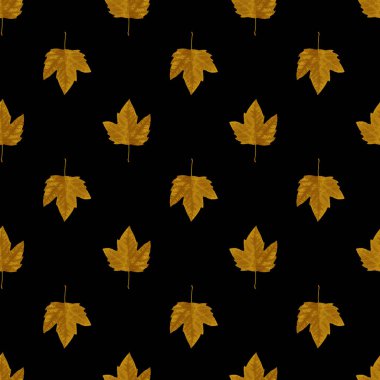 soyut dikişsiz desen: siyah arkaplana karşı altın rengi sonbahar yaprakları