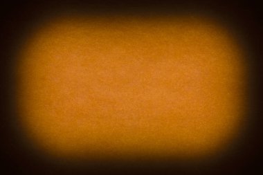 abstract backdrop for Halloween congratulation card: close up of orange tissue paper with shadowed edges