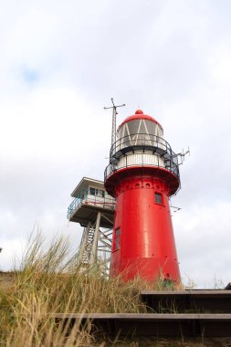 Red lighthouse on Dutch wadden island Vlieland