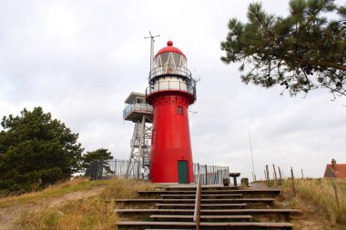 Red lighthouse on Dutch wadden island Vlieland