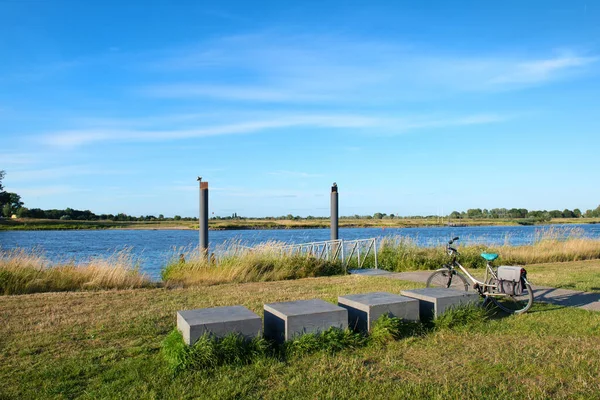 Landscape with bike near river the IJssel in Holland