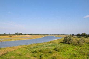 Landscape river the IJssel in Holland taken from the red bridge