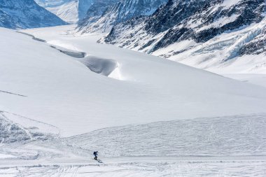 Apr 14, 2022 - Jungfraujoch, Swiss: A skier alone in the snow mountain. clipart