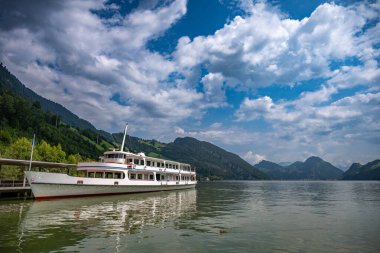 Alpnachstad Swiss Alps village on Luzern lake boat pier and landscape view, tourist destination in Switzerland clipart