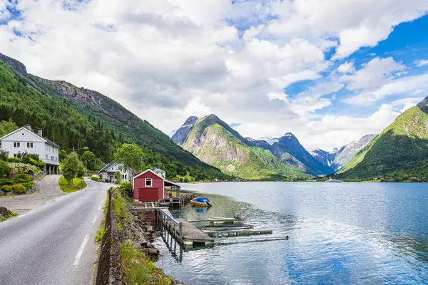 Stock image View over the Faejrlandfsjord with a red wooden hut in Norway.