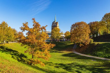 Autumn at the gate Kroepeliner Tor in the Hanseatic city of Rostock, Germany. clipart