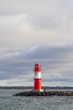 Pier with tower on shore of the Baltic Sea in Warnemuende, Germany. clipart