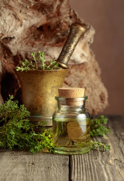 Bottle Thyme Essential Oil Fresh Thyme Twigs Old Wooden Table — Fotografia de Stock