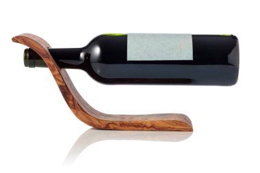 Bottle of red wine in a wooden bottle holder is isolated on a white background. On a bottle empty label.