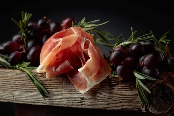 Prosciutto Grapes Rosemary Old Wooden Board — Stock Photo, Image