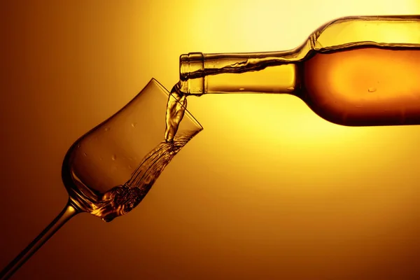 Digestive Tulip Premium Alcohol Yellow Background Drink Poured Bottle Glass — Fotografia de Stock
