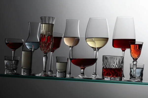Various Alcoholic Drinks Bar Tilted Glass Shelf — Stock Photo, Image