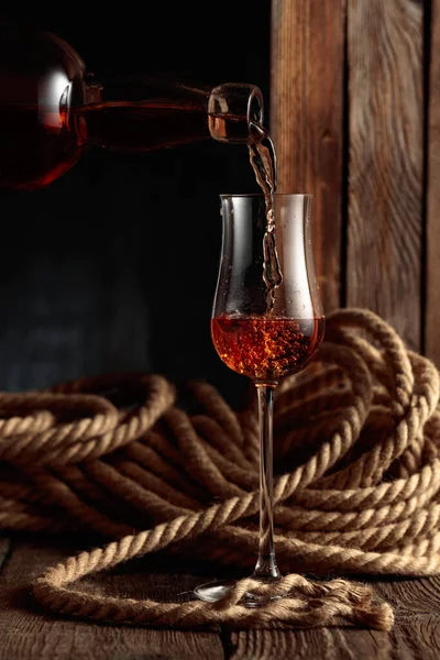 Rum Cognac Whiskey Poured Snifter Old Wooden Background Hemp Rope — Stock Photo, Image