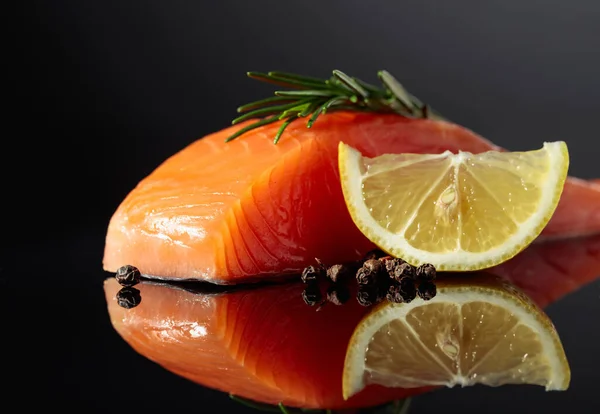 Smocked Salmon Piece Rosemary Lemon Peppercorn Black Reflective Background — Stok fotoğraf