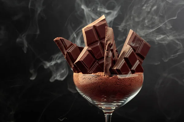 Broken Black Chocolate Bar Glass Cocoa Powder Chocolate Black Background — Stock Photo, Image