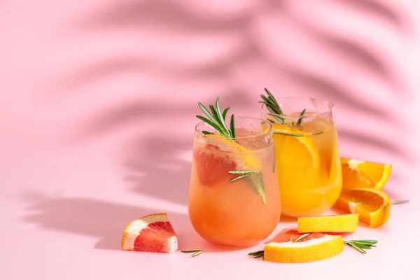 Summer Cocktails Grapefruit Orange Rosemary Ice Drinks Pink Background Palm — 스톡 사진