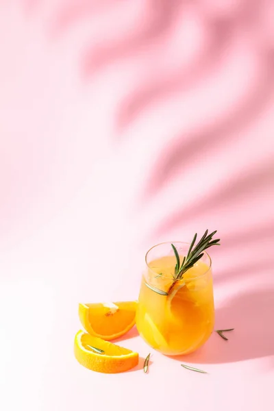 Summer Cocktail Orange Rosemary Ice Drink Pink Background Palm Leaf — 스톡 사진