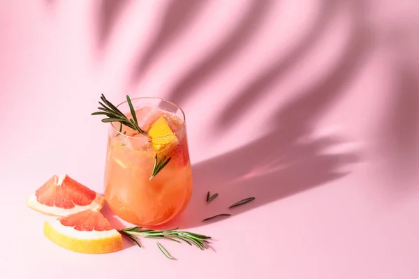 Summer Cocktail Grapefruit Rosemary Ice Drink Pink Background Palm Leaf —  Fotos de Stock