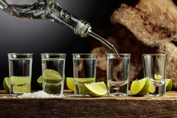 Tequila Poured Bottle Glass Strong Alcoholic Drink Salt Lime Slices — Foto Stock
