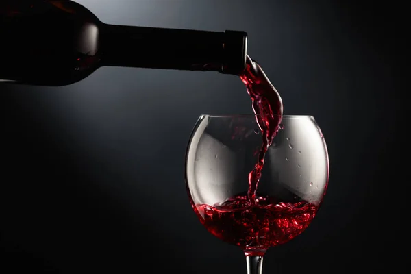 Pouring Red Wine Wine Glass Black Background — Stock Photo, Image