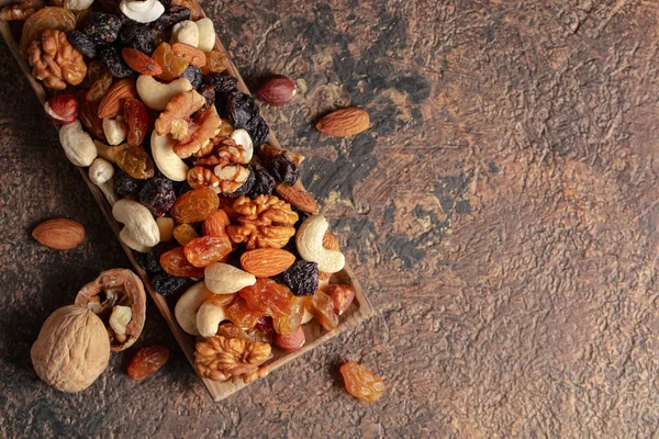 Mix Nuts Raisins Brown Rustic Background Presented Raisins Walnuts Hazelnuts — Stock Photo, Image