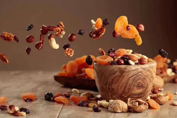 Flying Dried Fruits Nuts Mix Nuts Raisins Wooden Bowl Copy — Fotografia de Stock
