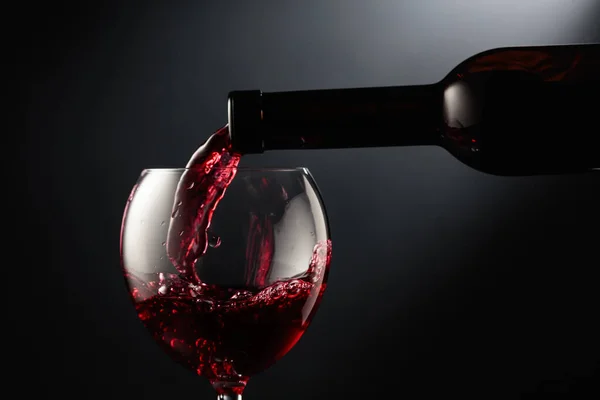 Pouring Red Wine Wine Glass Black Background — Stock Photo, Image