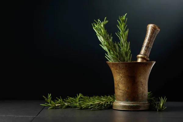 Old Brass Mortar Fresh Rosemary Branches Black Background Copy Space — Stock Photo, Image