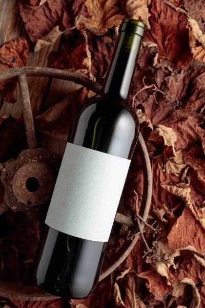 Bottle Red Wine Rusty Wheel Dried Vine Leaves Old Expensive — Stock Fotó