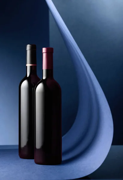 Bottles Red Wine Blue Background Copy Space — Stock Photo, Image