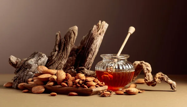 Almond Nuts Wooden Dish Honey Glass Jar Still Life Fresh — Stock Photo, Image