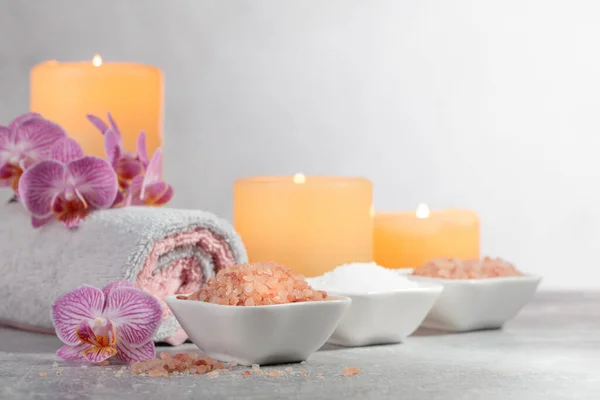 Sea Salt Towels Orchid Flowers Burning Candles Grey Background Spa — Stock Photo, Image