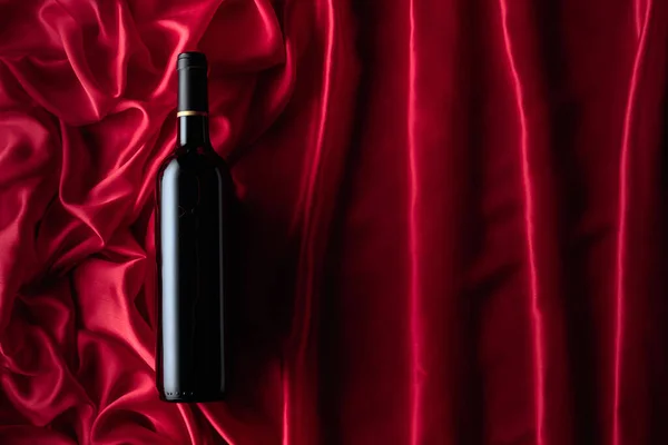 Bottle Red Wine Satin Background Top View — Stock Photo, Image