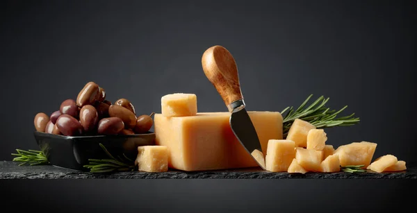 Parmesan Cheese Knife Olives Rosemary Black Background — Photo