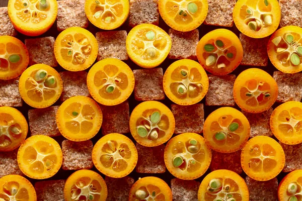 Cut Kumquat Slices Brown Sugar Pieces Top View — Stock Photo, Image